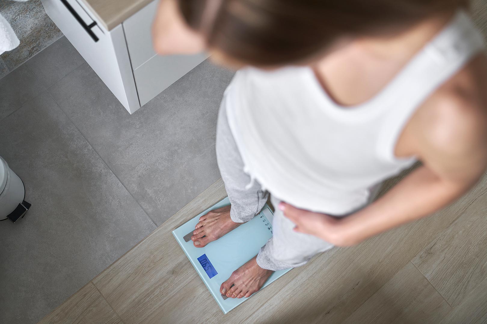 a person standing on a scale