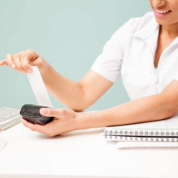 female-masseuse-printing-payment-receipt-smiling-beauty-spa-closeup-with-some-copy-space-min-min
